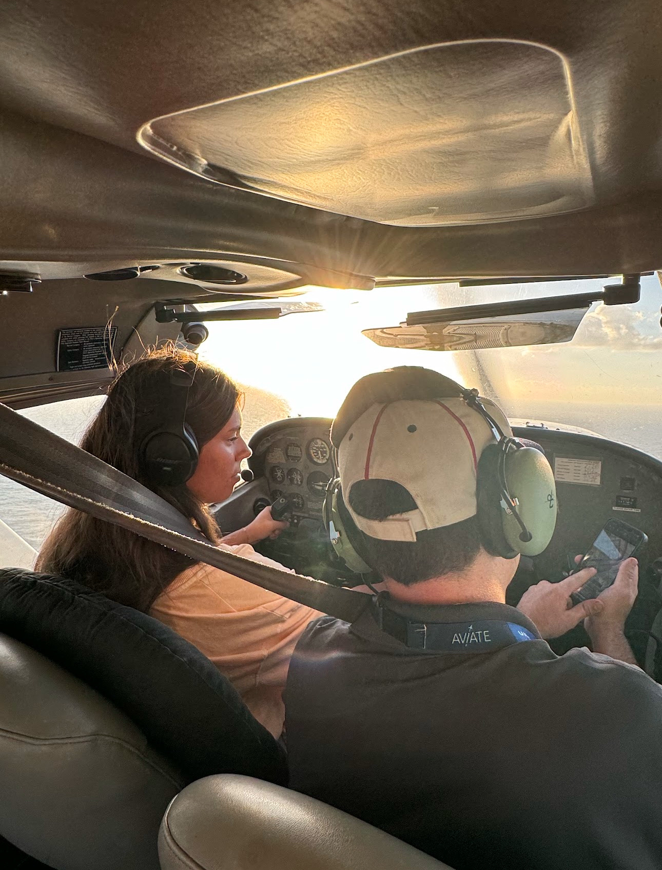 Flight instructor teaching student during discovery flight
