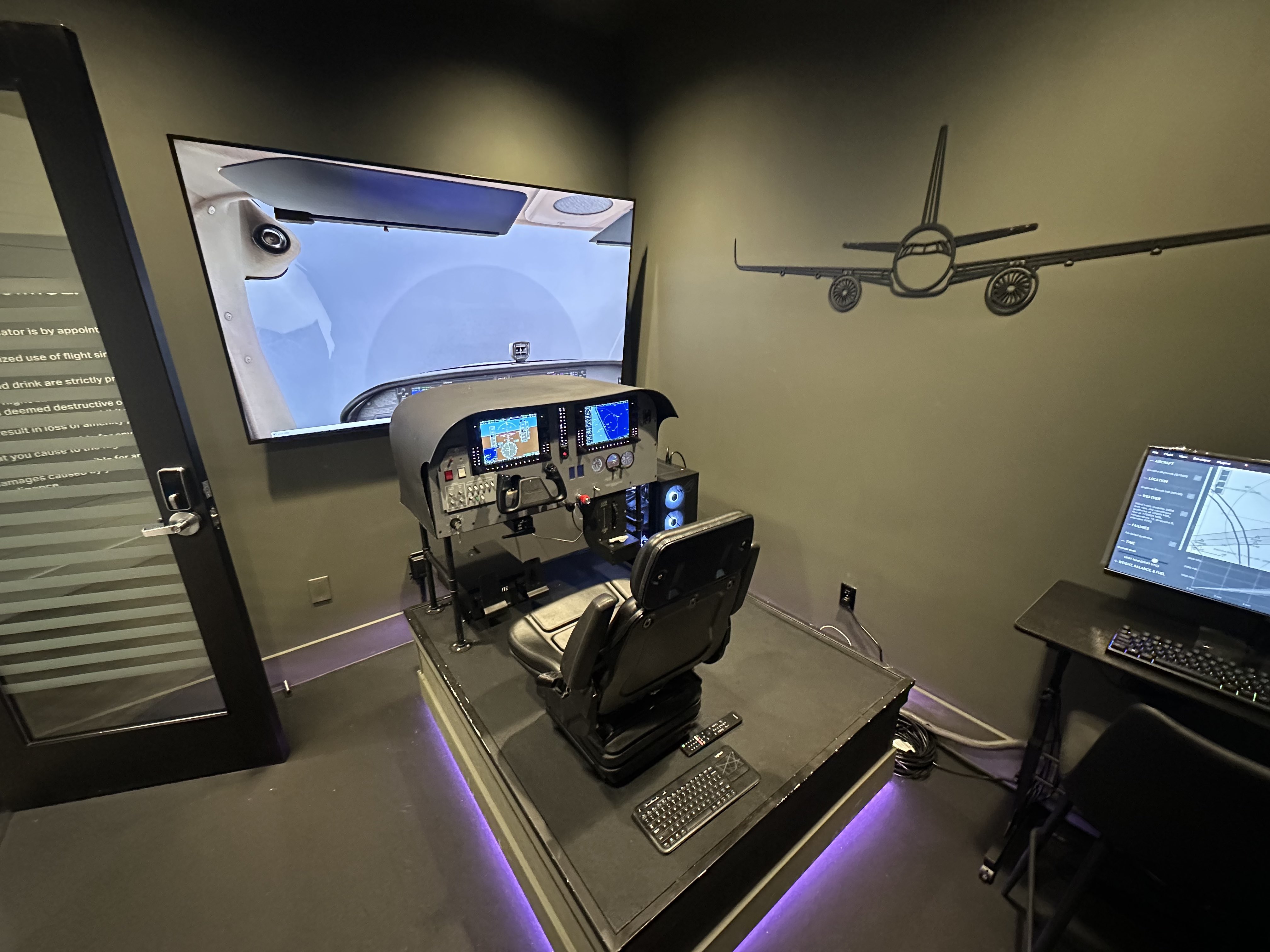 Professional flight simulator at OnShore Daytona with realistic cockpit and displays